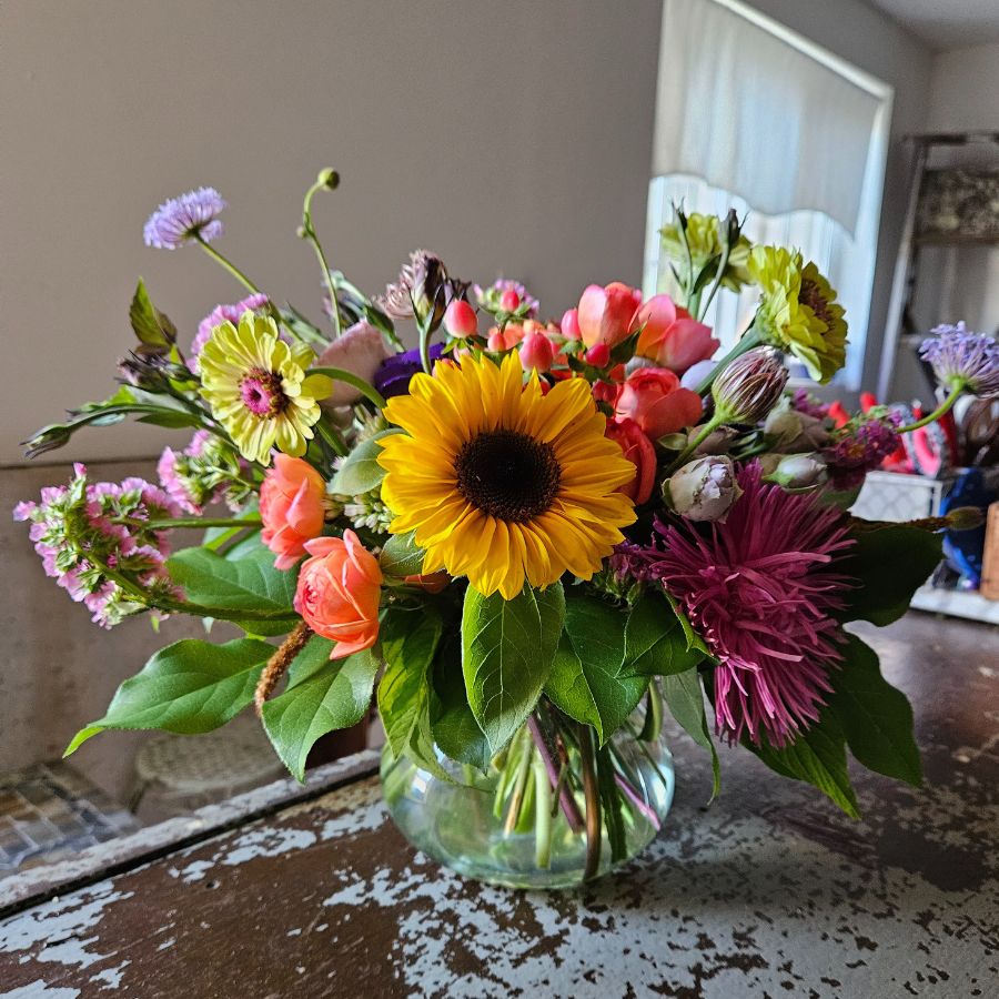 bright summer flower arrangement with sunflower