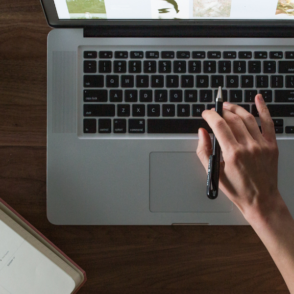 hand typing on laptop